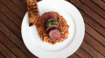 Grillet struds med tomat-risotto